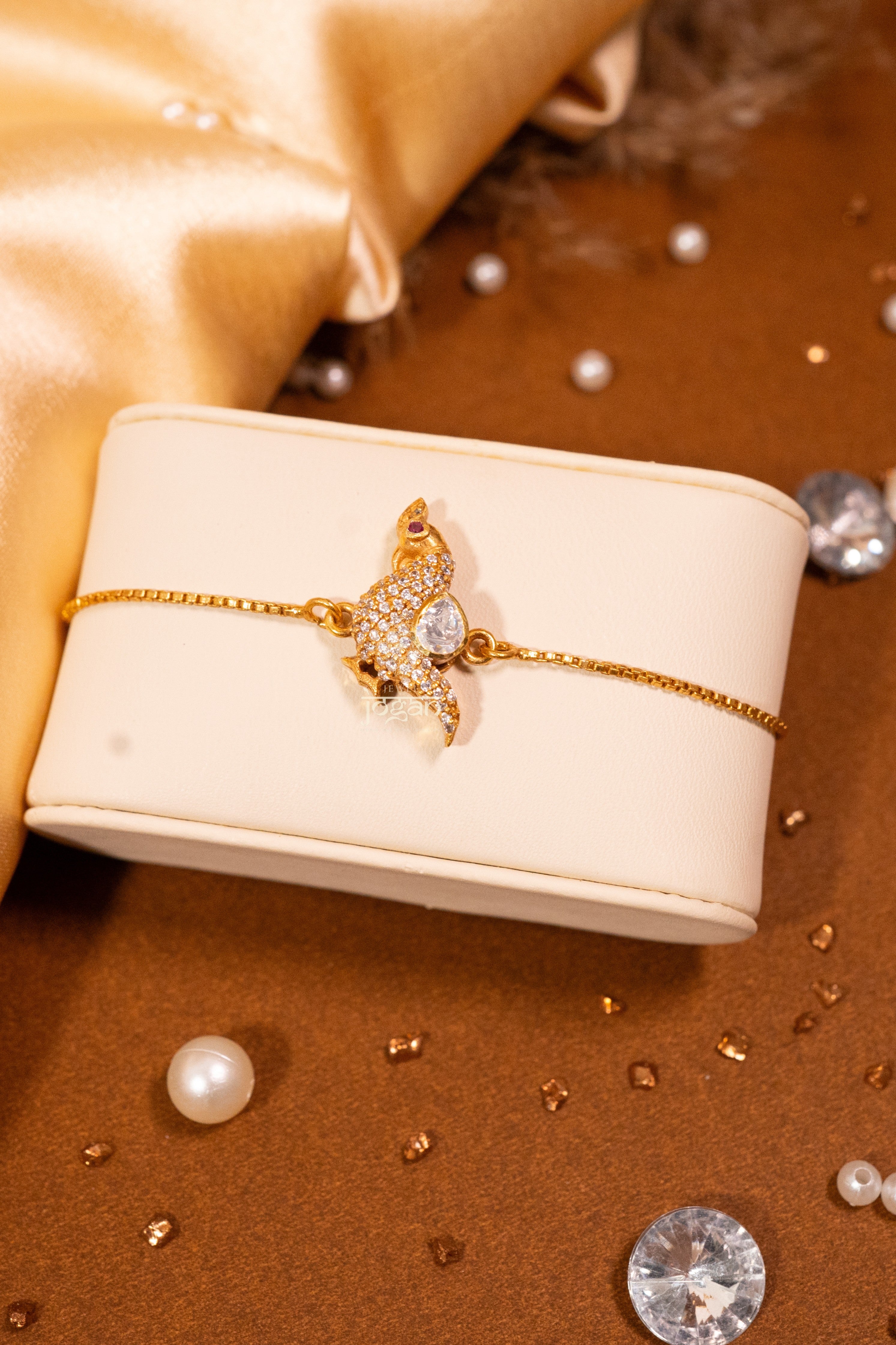 Gold-plated 925 sterling silver adjustable bracelet with lab grown polki stones, featuring peacock inspired design.
