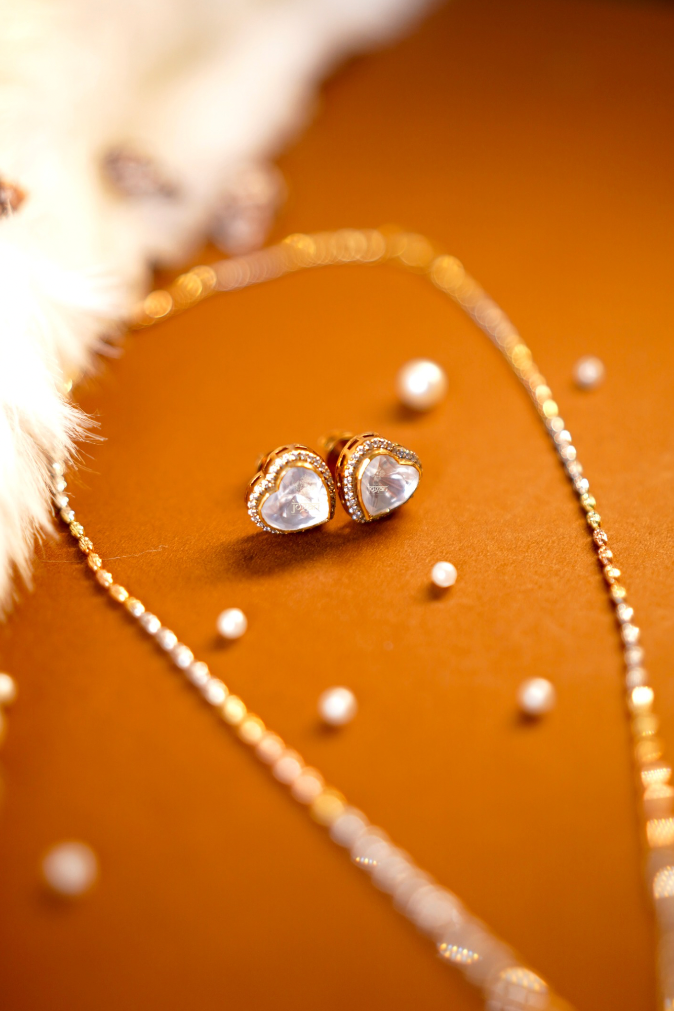 Heart-shaped gold-plated silver stud earrings with lab grown polki and CZ stones.
