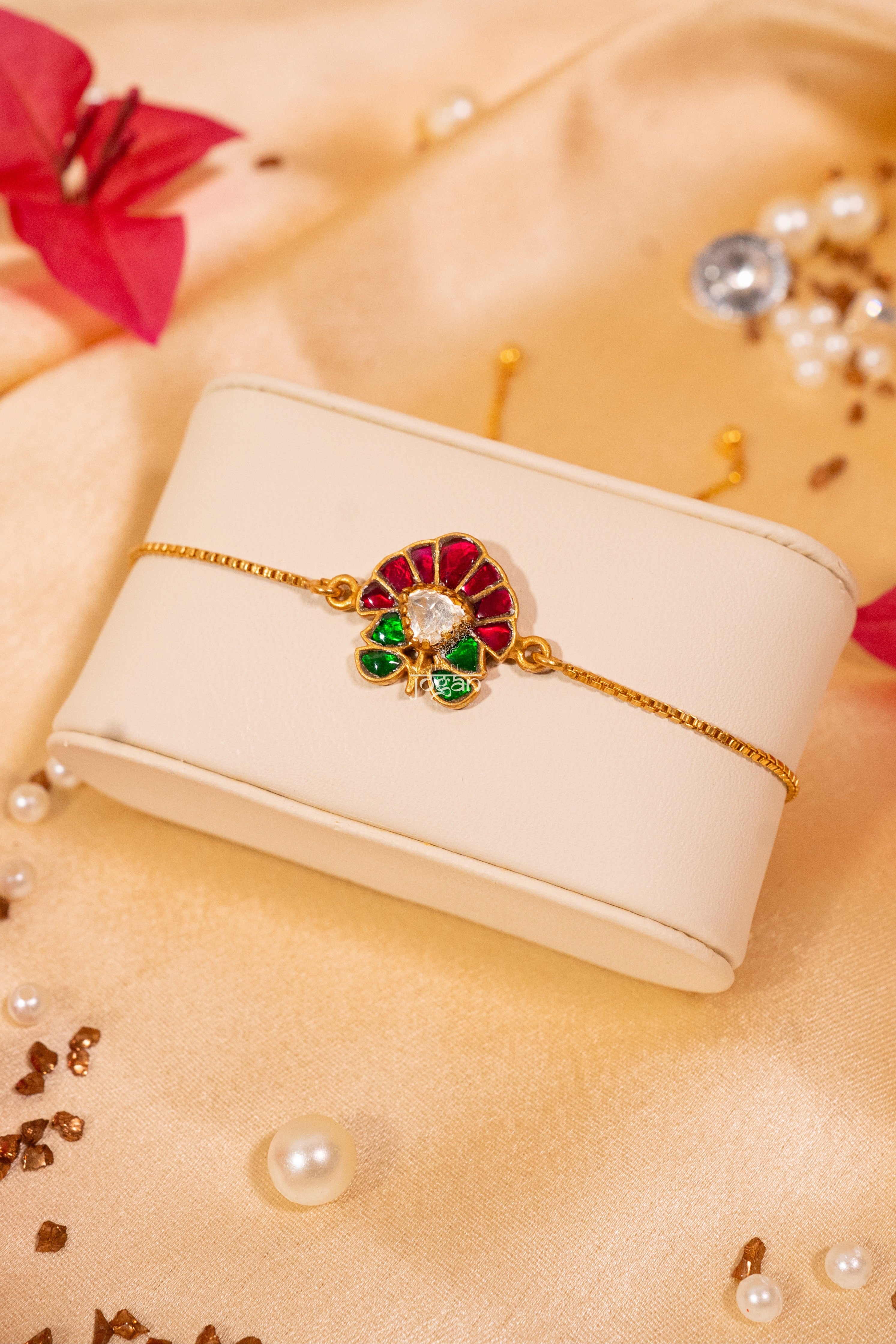 Adjustable gold-plated 92.5 sterling silver bracelet with lab grown polki pink/red, green semi precious stones (kundan setting) and floral-inspired motifs, festive statement design