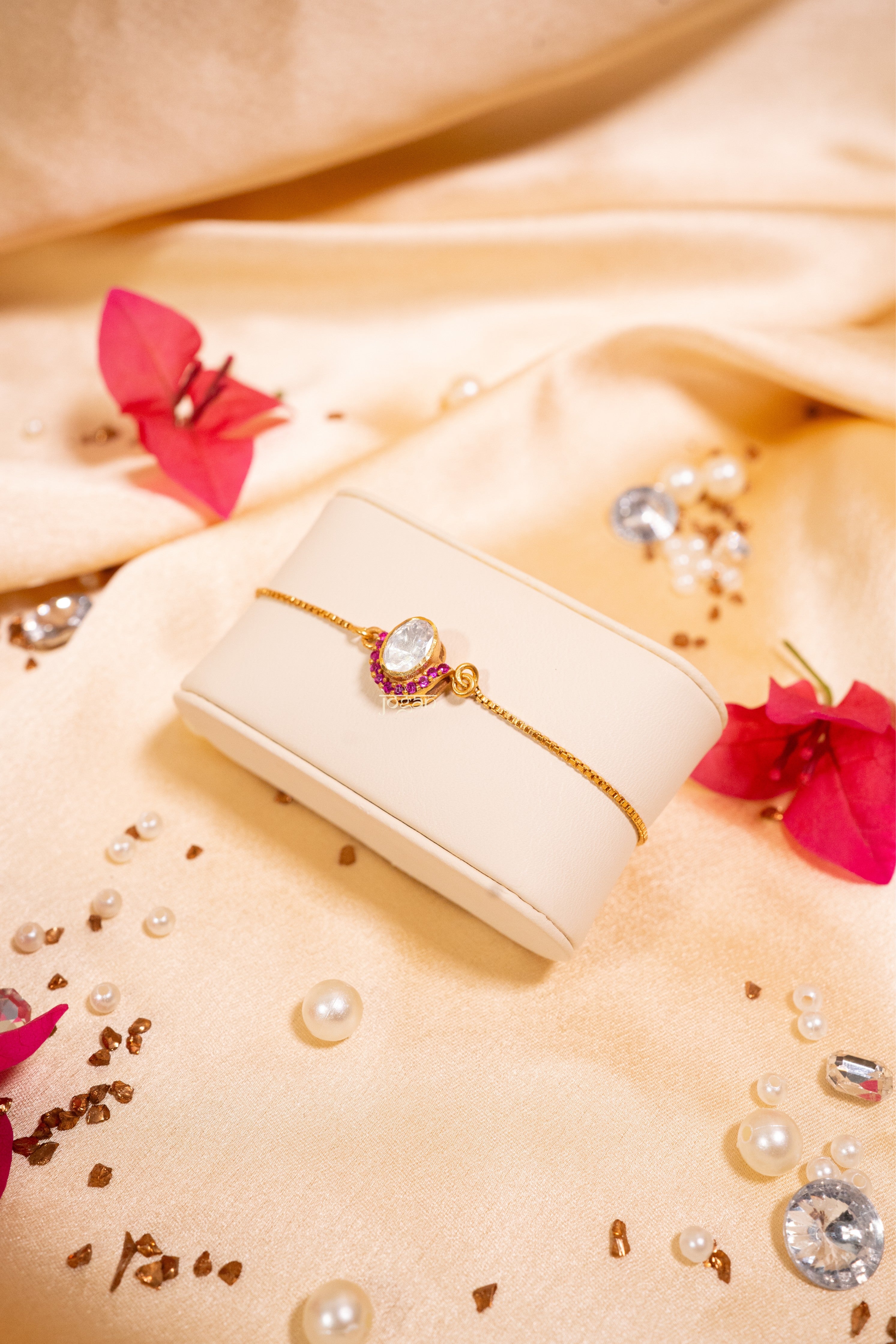 Gold-plated 92.5 sterling silver adjustable bracelet with lab grown polki, ruby-like stones, classic Indian festive elegance.
