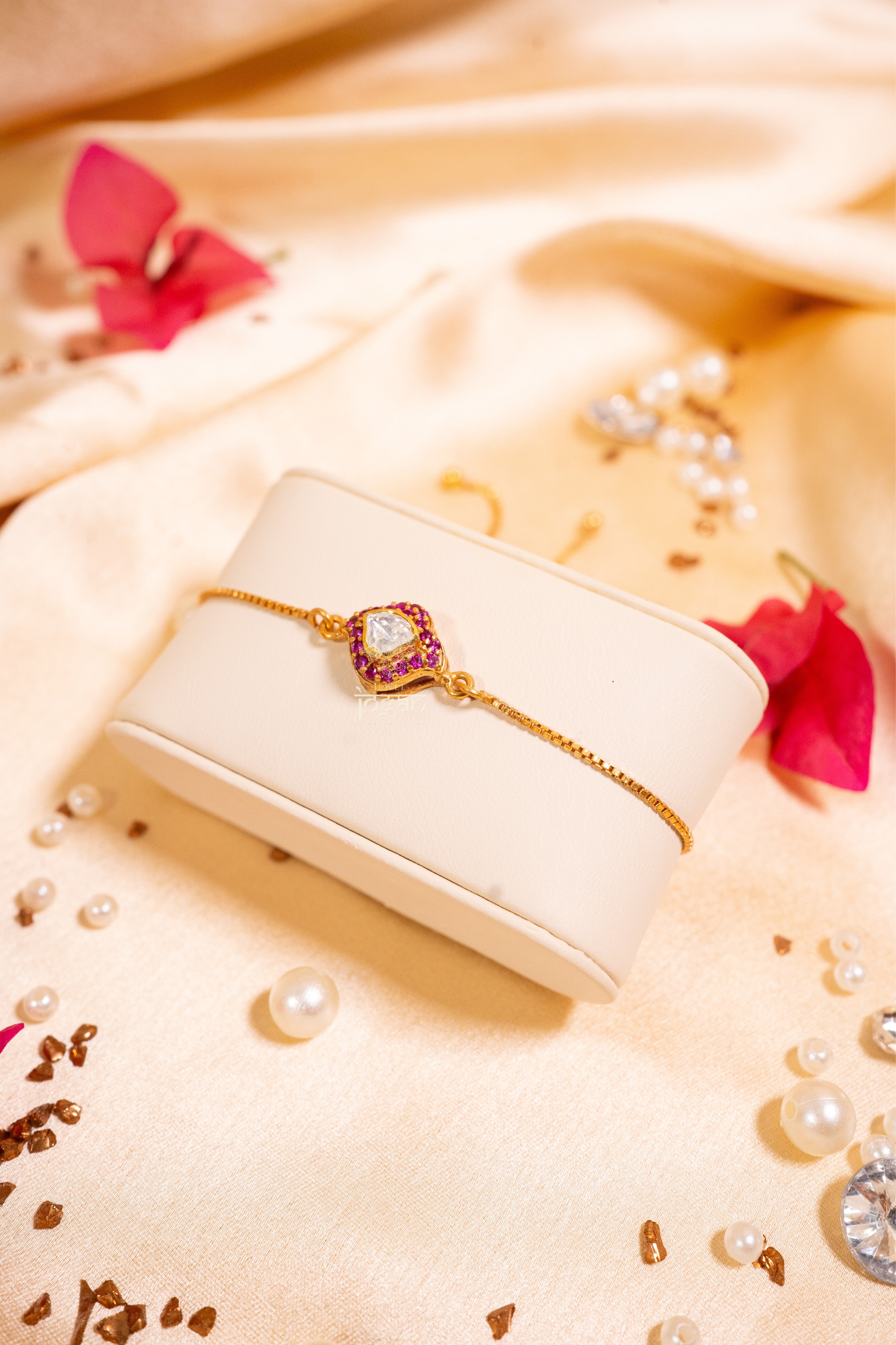 Adjustable gold-plated 92.5 sterling silver bracelet with lab grown polki and ruby-like stones, bell-inspired festive design
