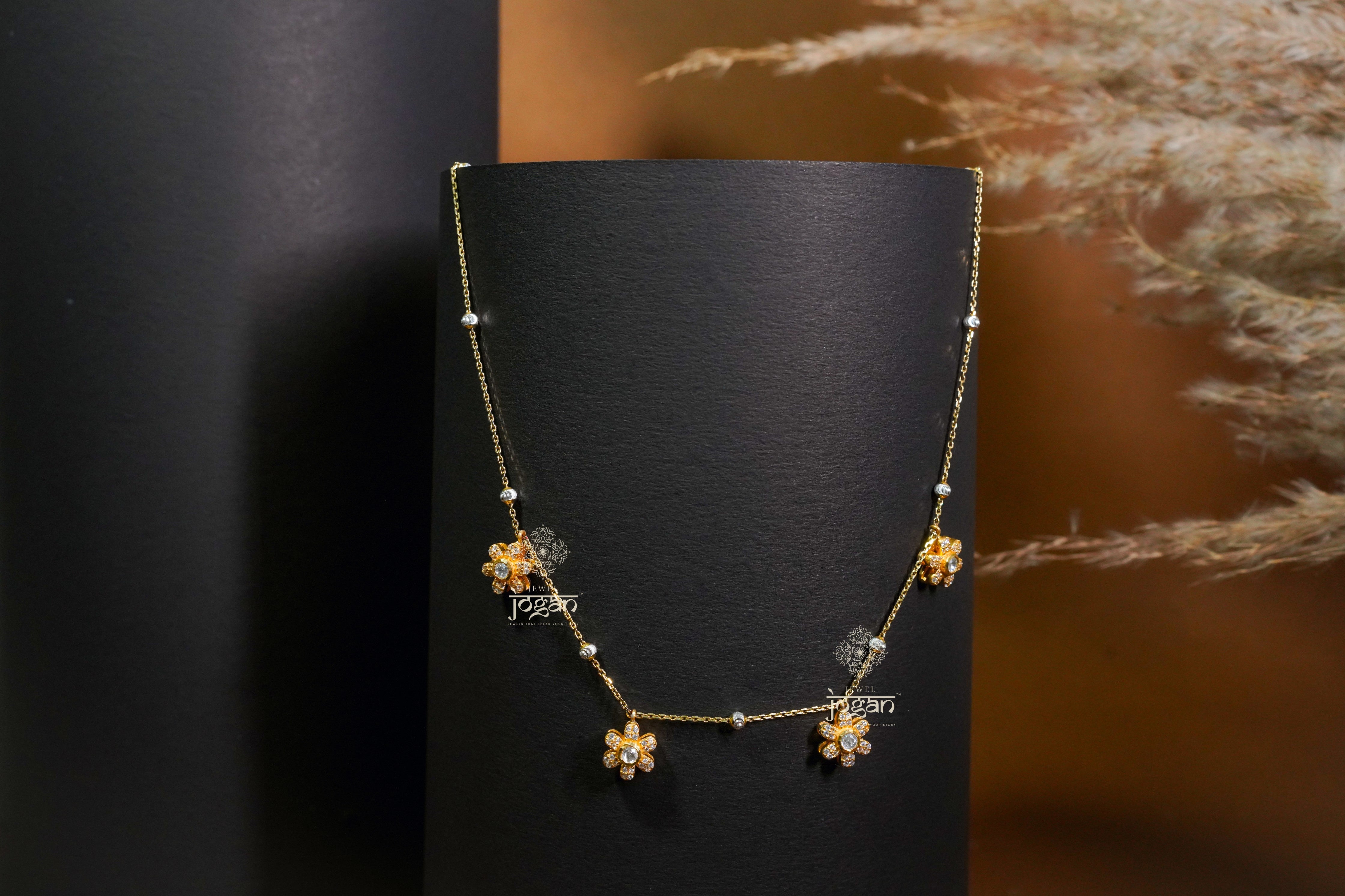 Gold-plated silver chain with floral links and subtle lab grown polki, minimalist for everyday layering.
