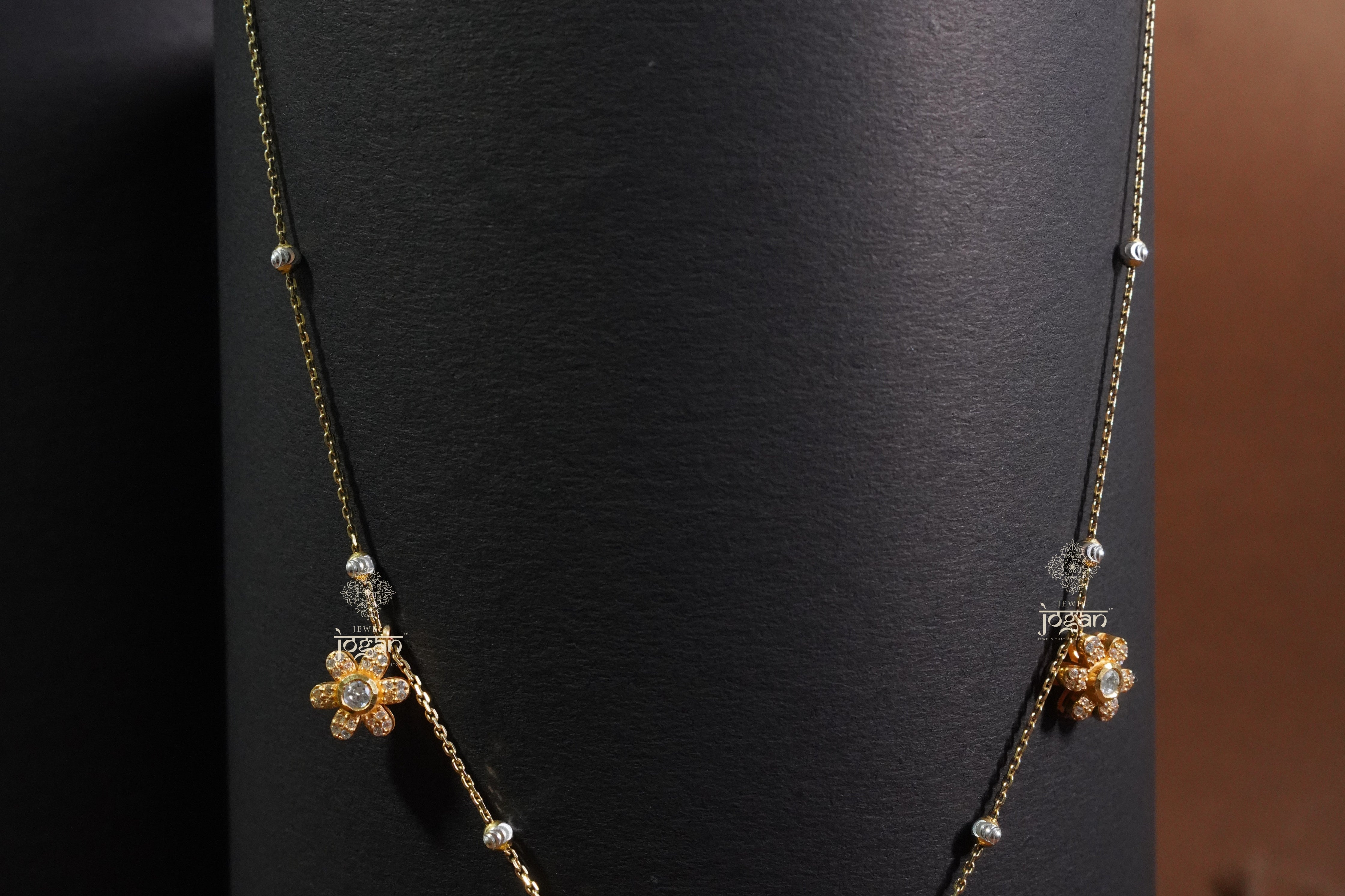 Gold-plated silver chain with floral links and subtle lab grown polki, minimalist for everyday layering.
