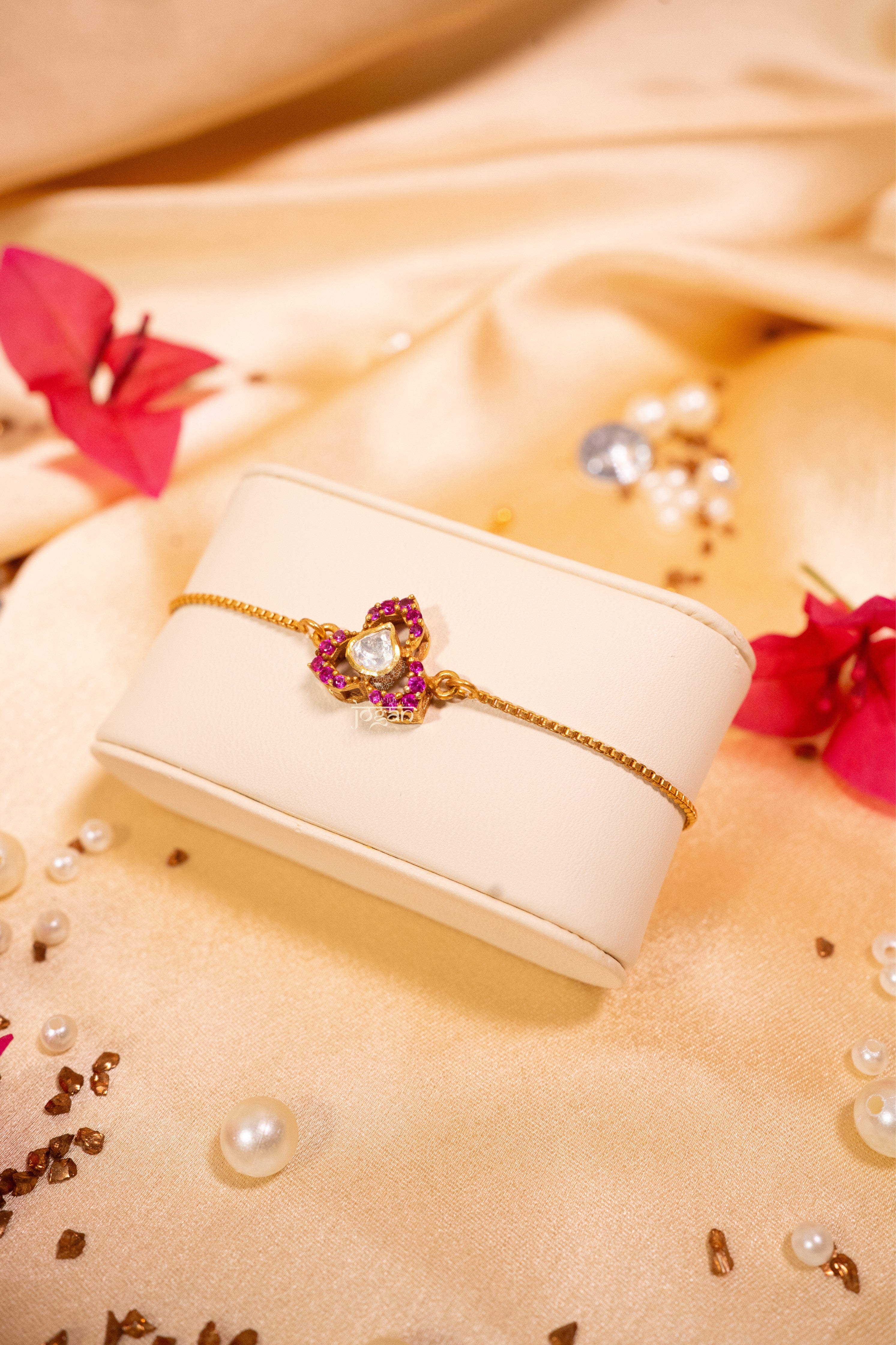 Gold-plated 92.5 sterling silver adjustable bracelet with lab grown polki and ruby-like stones, inspired by classic floral design and festive elegance.