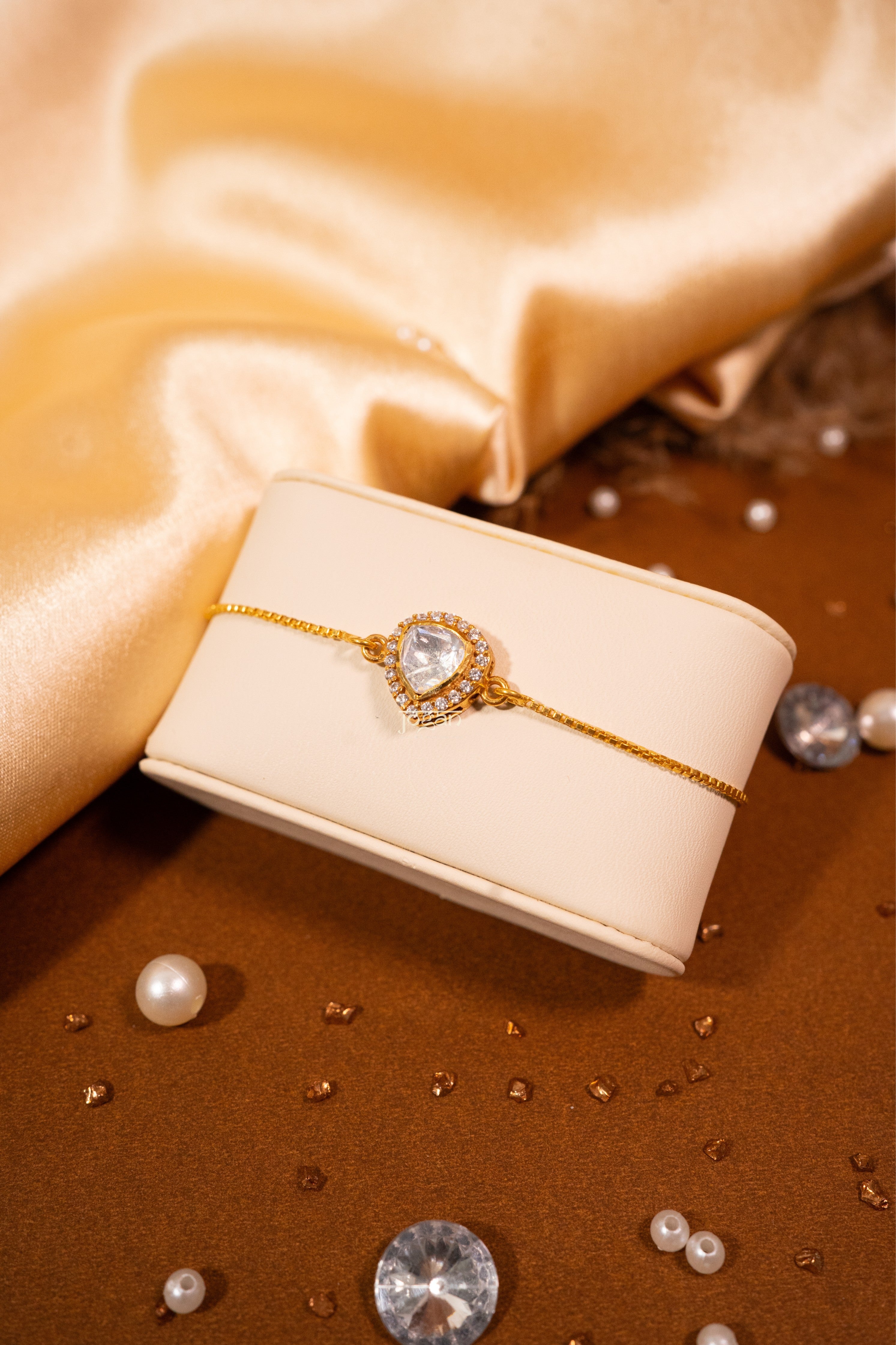 Adjustable gold-plated 92.5 silver bracelet with lab grown polki and CZ stones, inspired by teardrop halo.
