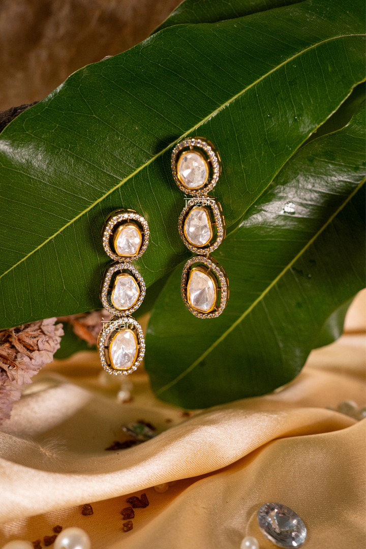 Gold‑plated 925 silver long drop earrings with triple oval lab grown polki stones, bezel set with CZ halos, elegant evening style.