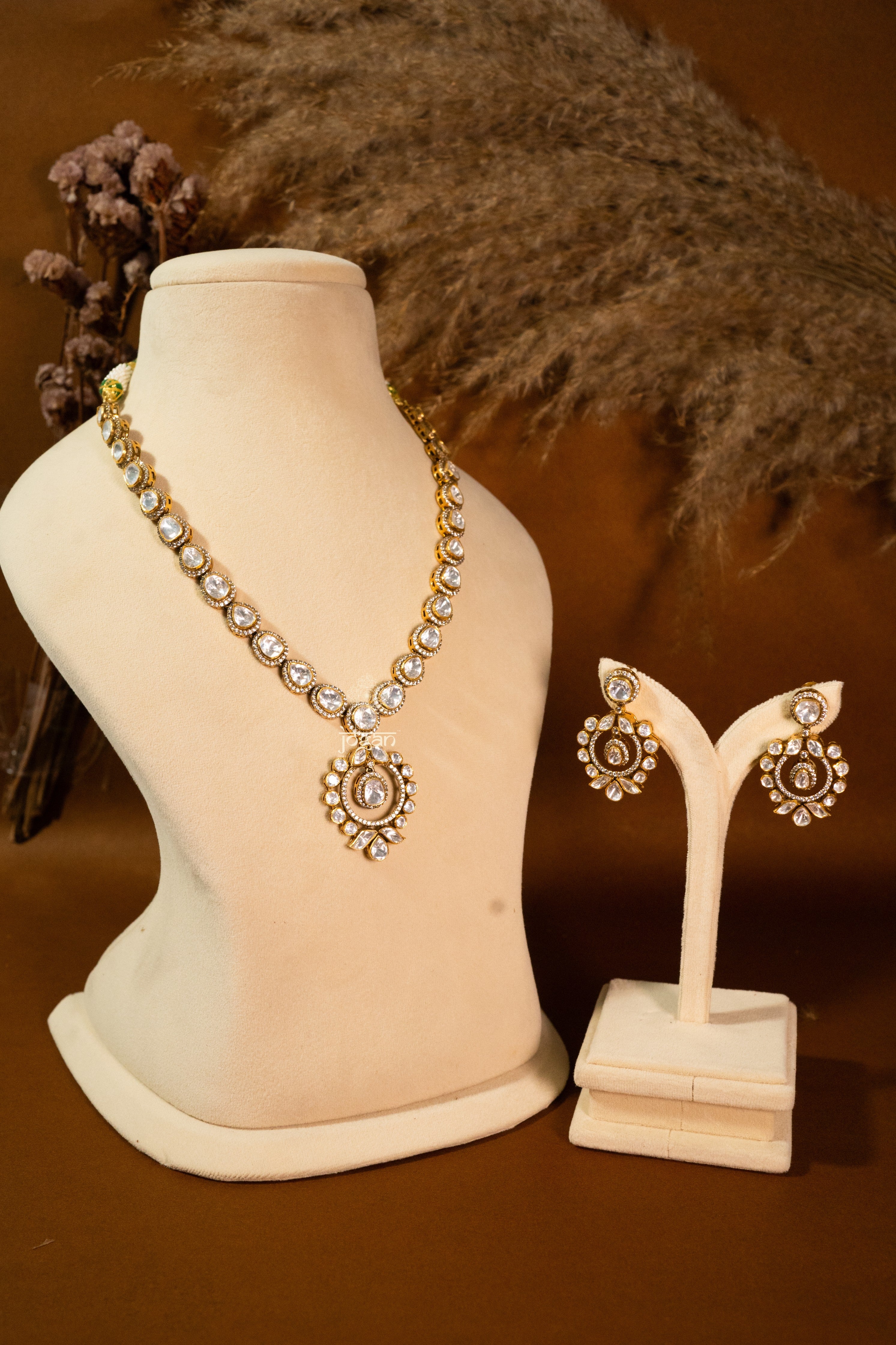 Vasundhara necklace set with lab grown polki stones and gold-plated 92.5 sterling silver, featuring detailed Indian floral motifs and intricate craftsmanship.