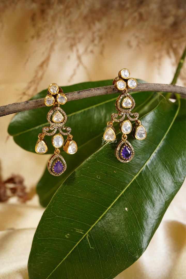Shobhita tiered dangler earrings featuring luminous lab-grown Polkis and an amethyst-toned semi-precious stone drop in gold-plated metal, offering graceful movement and refined sparkle for cocktail parties, festive occasions, and elegant evenings