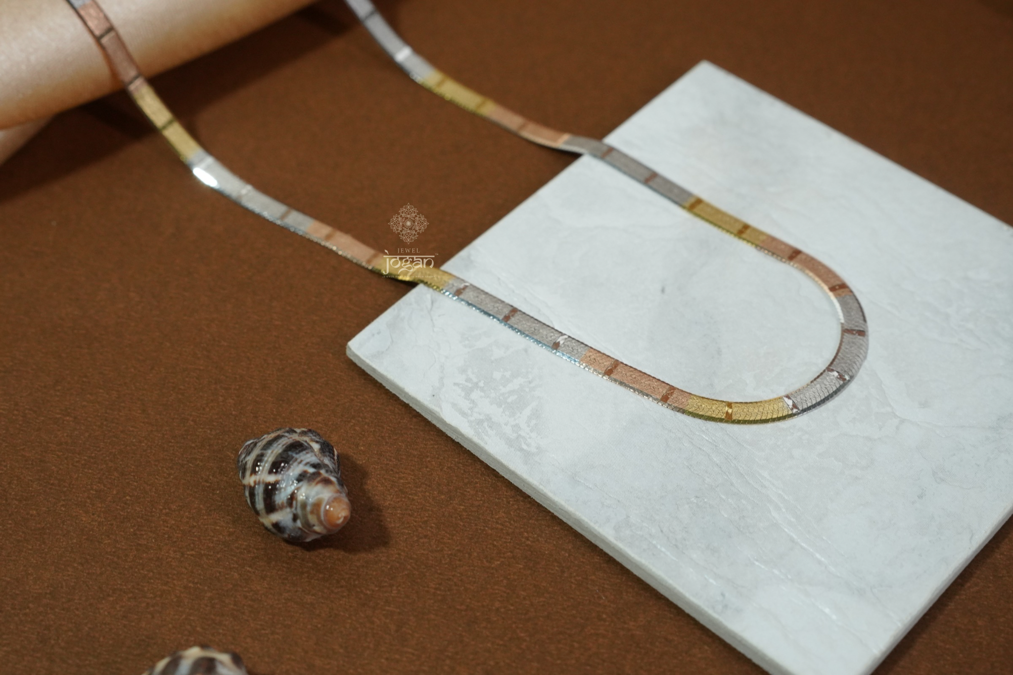 Tri-color Italian flat chain in 92.5 sterling silver with yellow, rose, and white tones. Perfect match for any pendant and ideal for solo or layered wear.