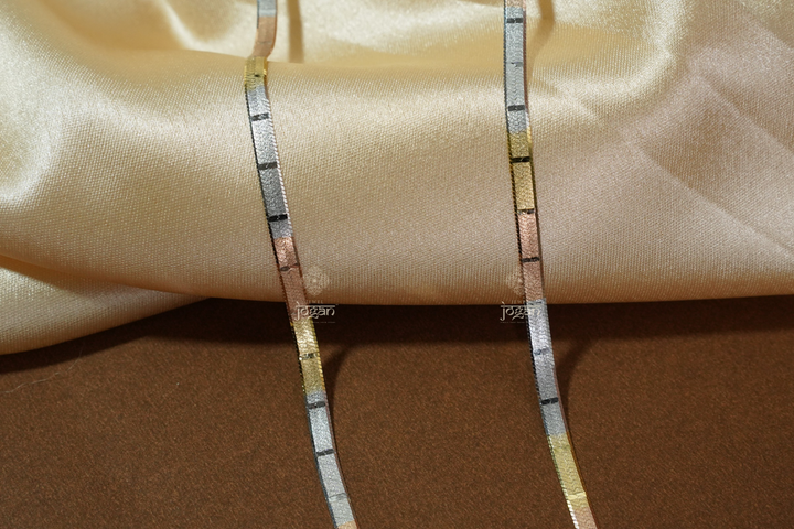 Tri-color Italian flat chain in 92.5 sterling silver with yellow, rose, and white tones. Perfect match for any pendant and ideal for solo or layered wear.