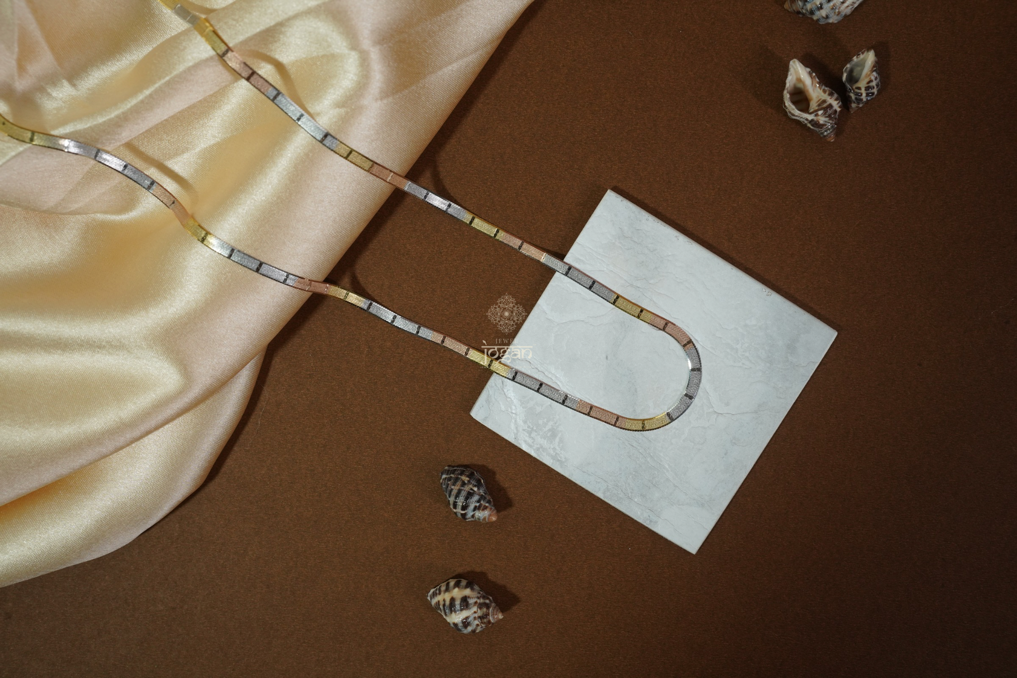 Tri-color Italian flat chain in 92.5 sterling silver with yellow, rose, and white tones. Perfect match for any pendant and ideal for solo or layered wear.