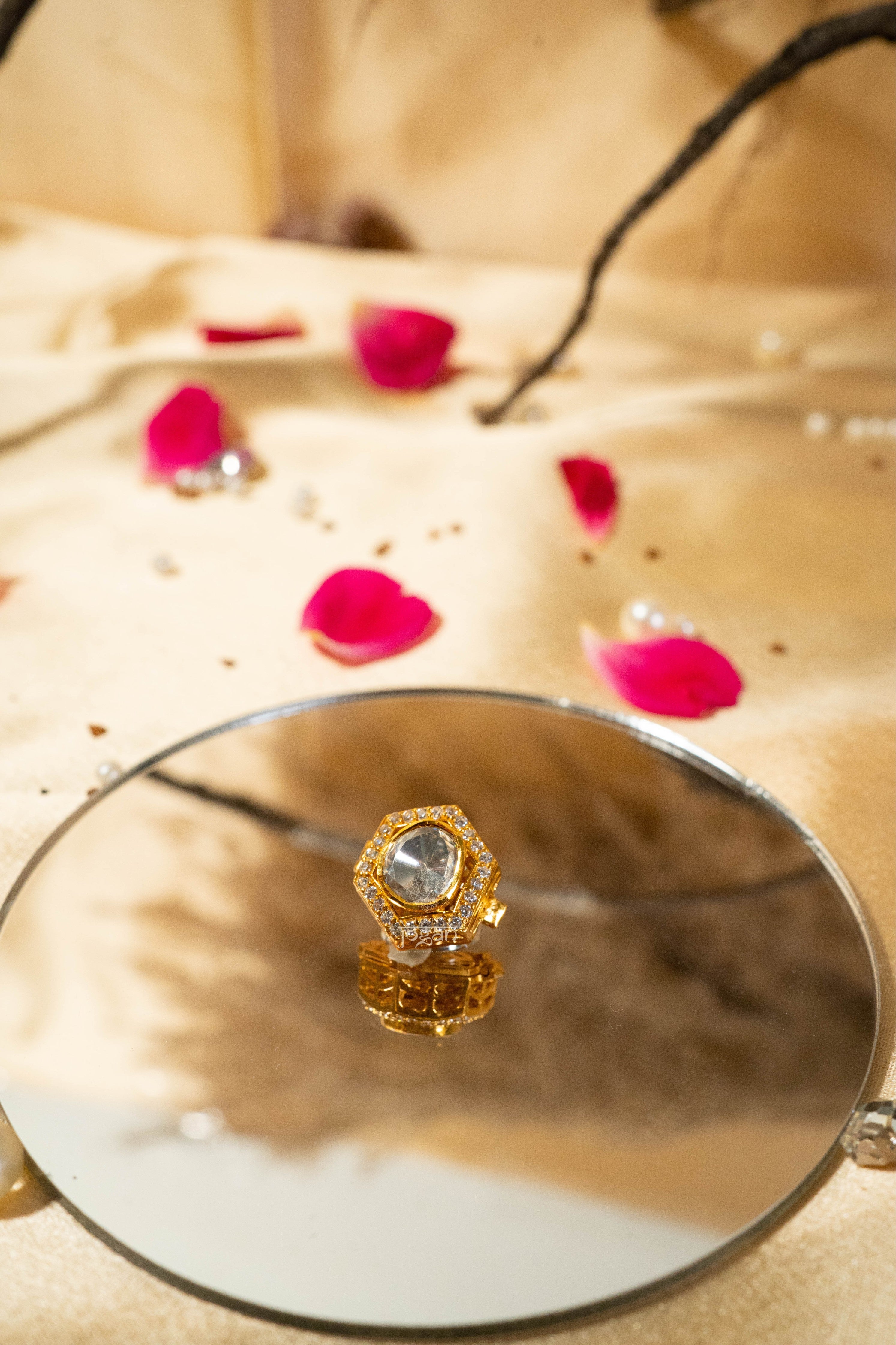 Shatkoni signature six-sided button cover symbolizing masculinity, balance, and strength.
