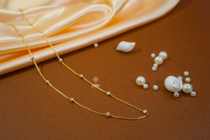 Italian beaded chain in gold finish with evenly spaced rhodium-toned beads, perfect for solo wear or layering with pendants.