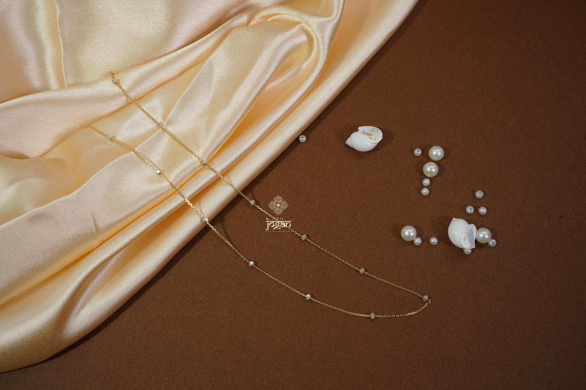 Italian beaded chain in gold finish with evenly spaced rhodium-toned beads, perfect for solo wear or layering with pendants.