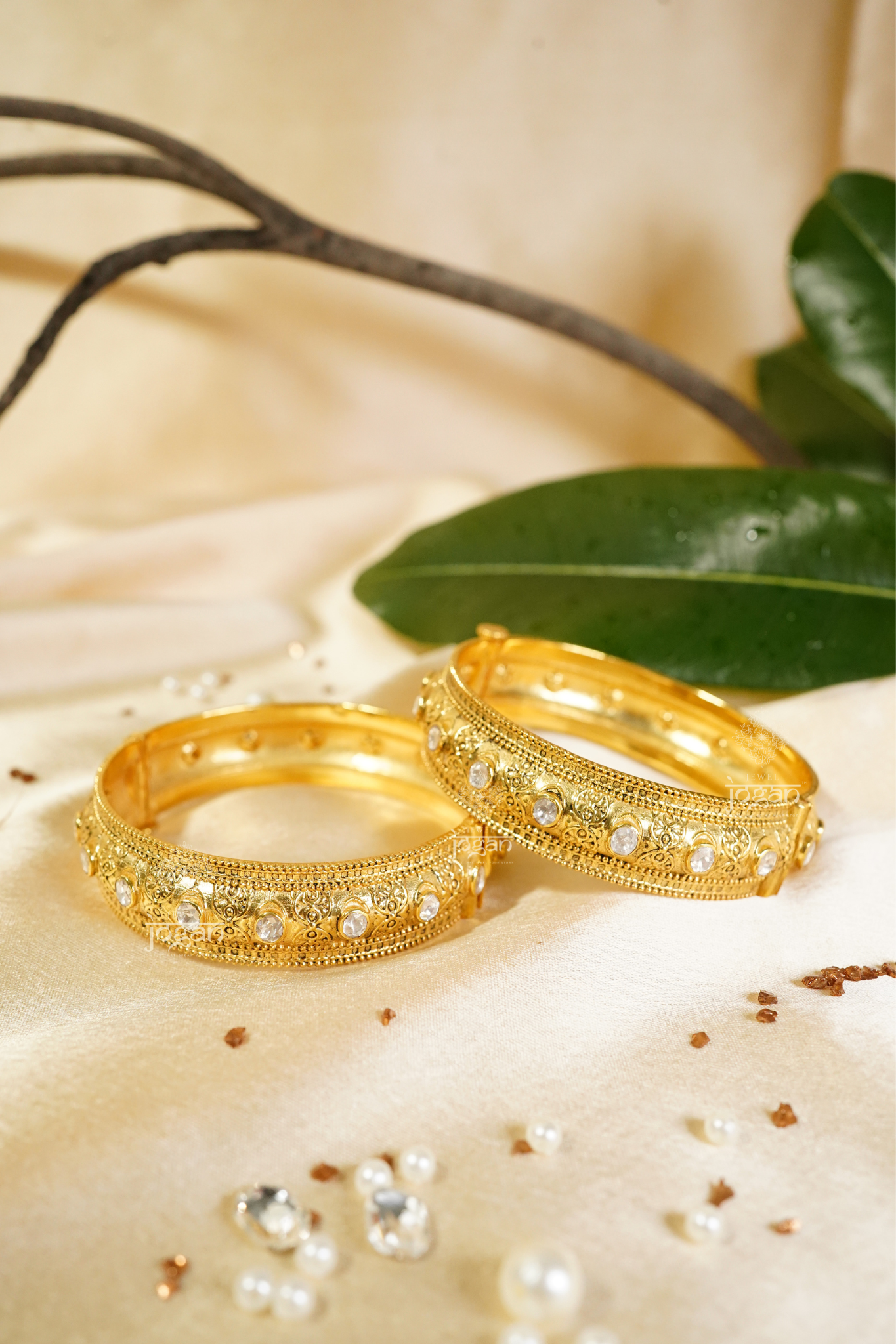 Intricate gold-plated Suvarnaa Kadaa with shimmering lab-grown Polkis, featuring a wide, ornate design. These traditional Indian bangles are perfect for cultural events, weddings, and festive occasions like Diwali or Eid. The elegant filigree work and radiant stones appeal to those seeking authentic, high-quality Indian jewelry with a touch of modern luxury. Suitable for women of all ages and a great gift option.
