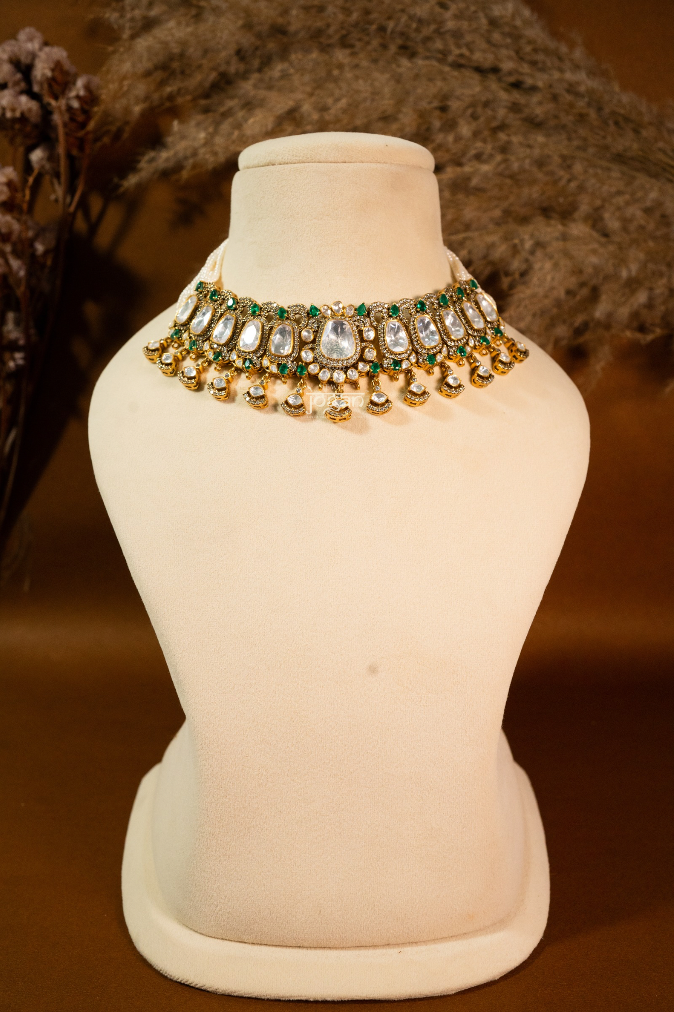 Sitabani Necklace Set by Jewel Jogan — handcrafted choker necklace and matching earrings in 92.5 sterling silver with gold plating. Features lab-grown polkis and emerald-toned semi-precious stones, offering a regal green-and-gold look. Perfect for brides, wedding guests, and festive occasions seeking traditional yet contemporary elegance.