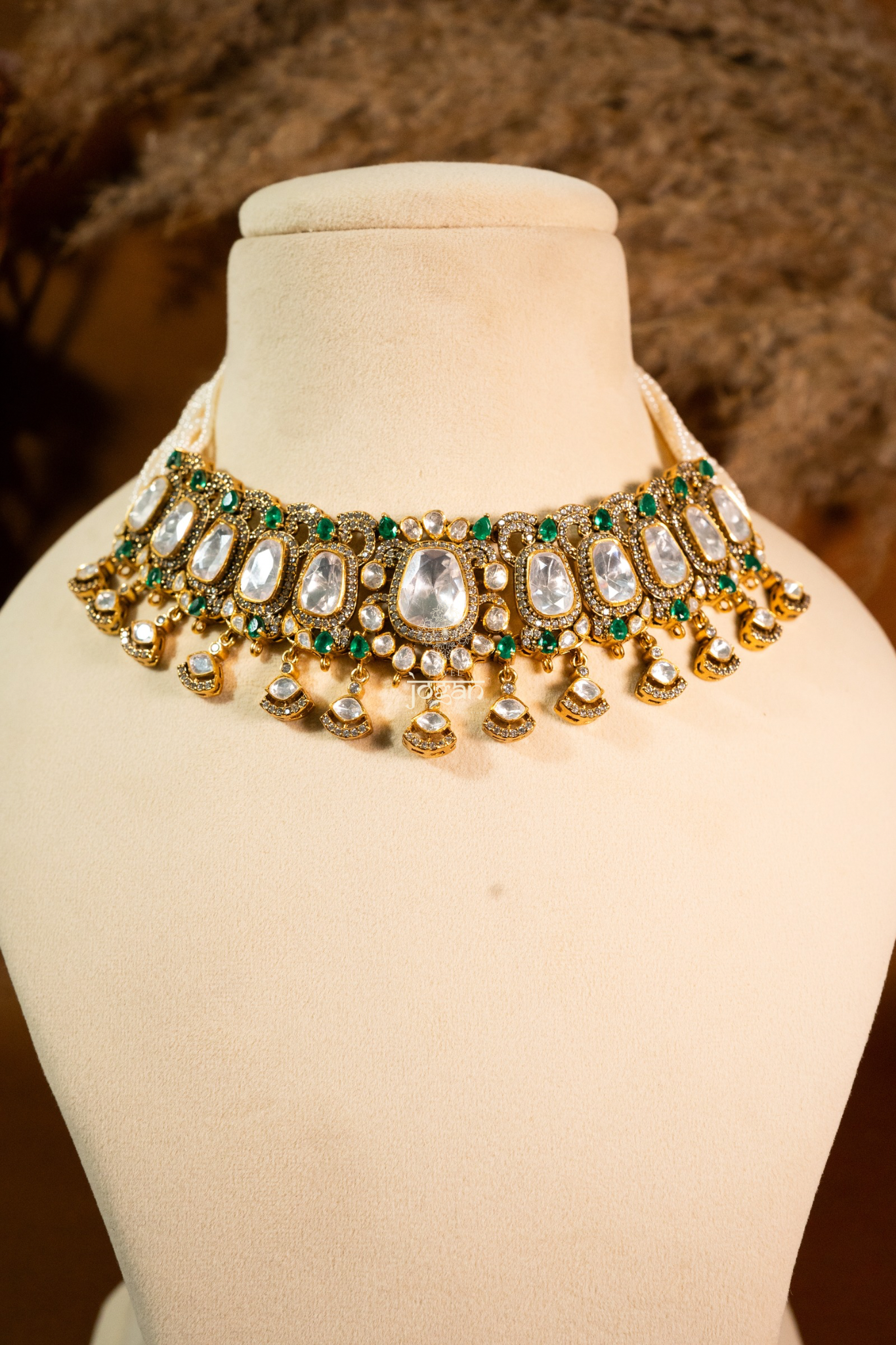 Sitabani Necklace Set by Jewel Jogan — handcrafted choker necklace and matching earrings in 92.5 sterling silver with gold plating. Features lab-grown polkis and emerald-toned semi-precious stones, offering a regal green-and-gold look. Perfect for brides, wedding guests, and festive occasions seeking traditional yet contemporary elegance.