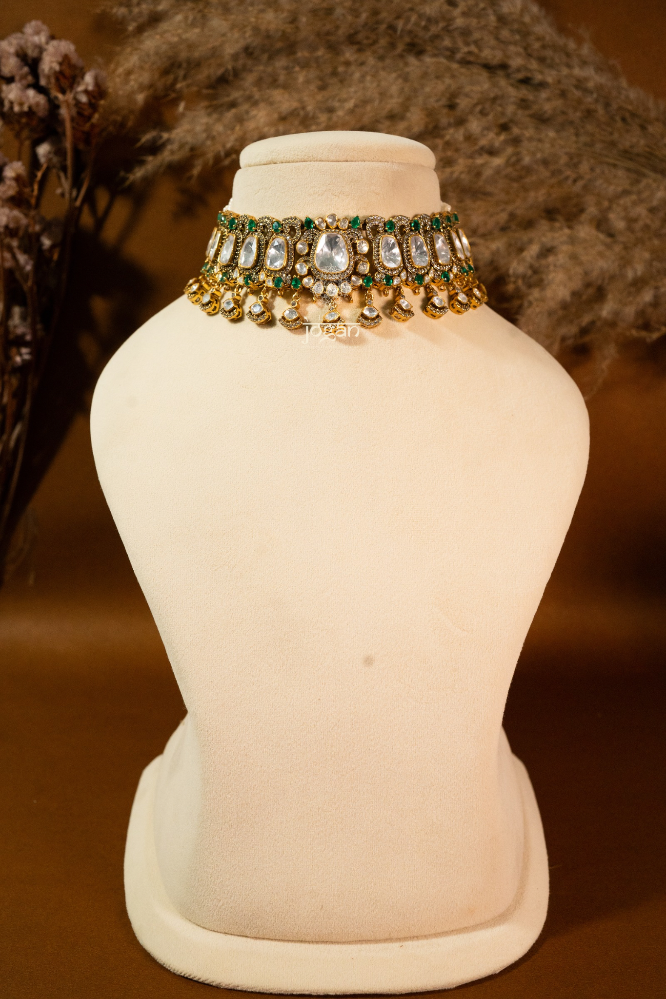 Sitabani Necklace Set by Jewel Jogan — handcrafted choker necklace and matching earrings in 92.5 sterling silver with gold plating. Features lab-grown polkis and emerald-toned semi-precious stones, offering a regal green-and-gold look. Perfect for brides, wedding guests, and festive occasions seeking traditional yet contemporary elegance.