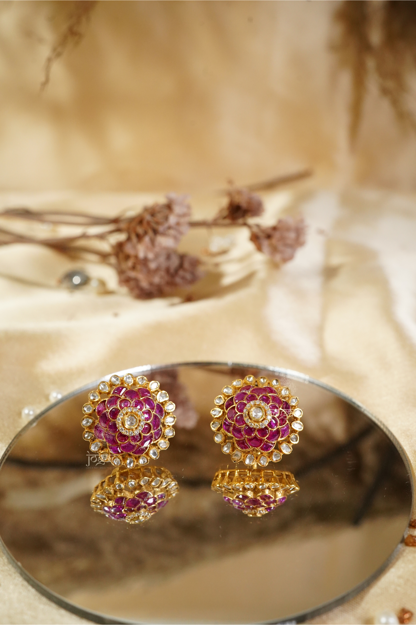Padam Raaga floral stud earrings featuring ruby-toned semi-precious stones and lab-grown Polkis in gold-plated metal, offering vibrant color and ornate charm for festive occasions, daytime wear, and artful styling.